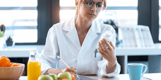 A doctor or pharmacist examining some nutraceuticals,
