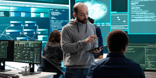 Team members discussing proper cybersecurity risk management practices
