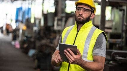 man wearing eye protection equipment while working