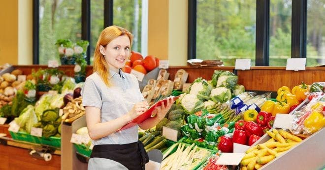 grocery staff checking safety protocols