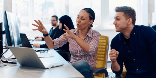 Work team discussing process improvement metrics in an office setting