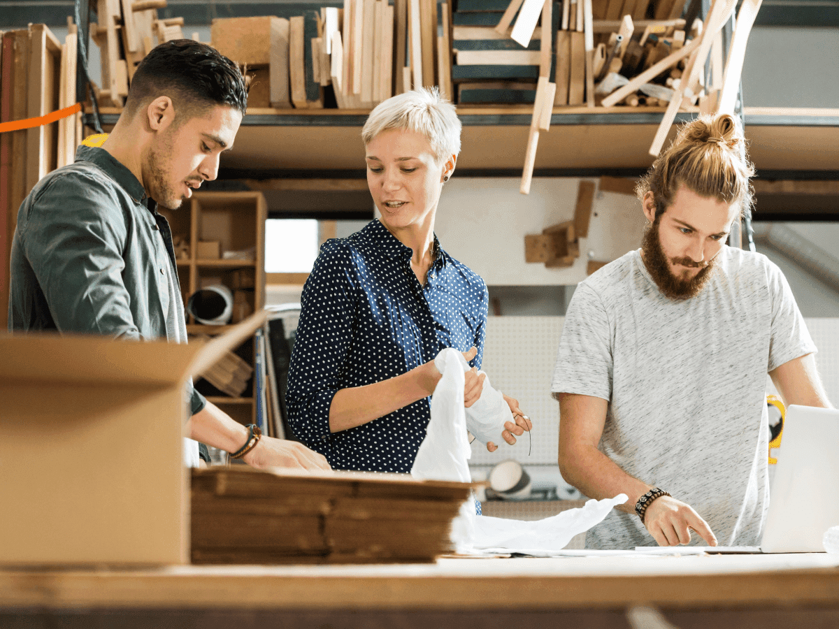 Manufacturing workers working together for psychological safety and total worker health